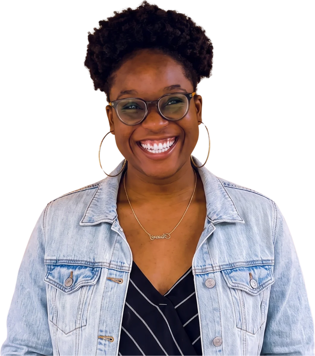 A smiling GetHealthPlans.com member in a denim jacket