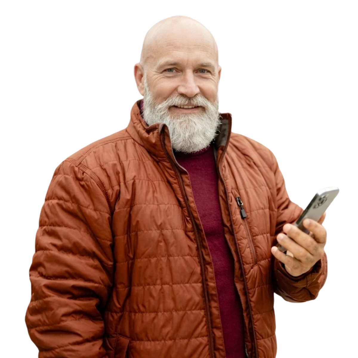 Smiling older man in a quilted jacket holding his phone