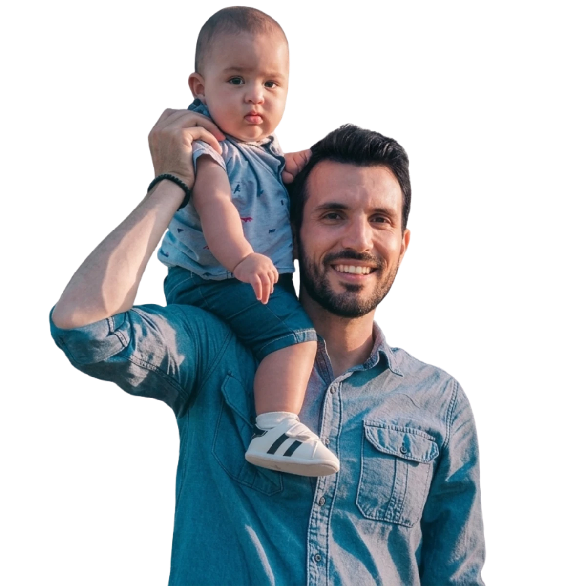 Young father smiling with his toddler on his shoulders