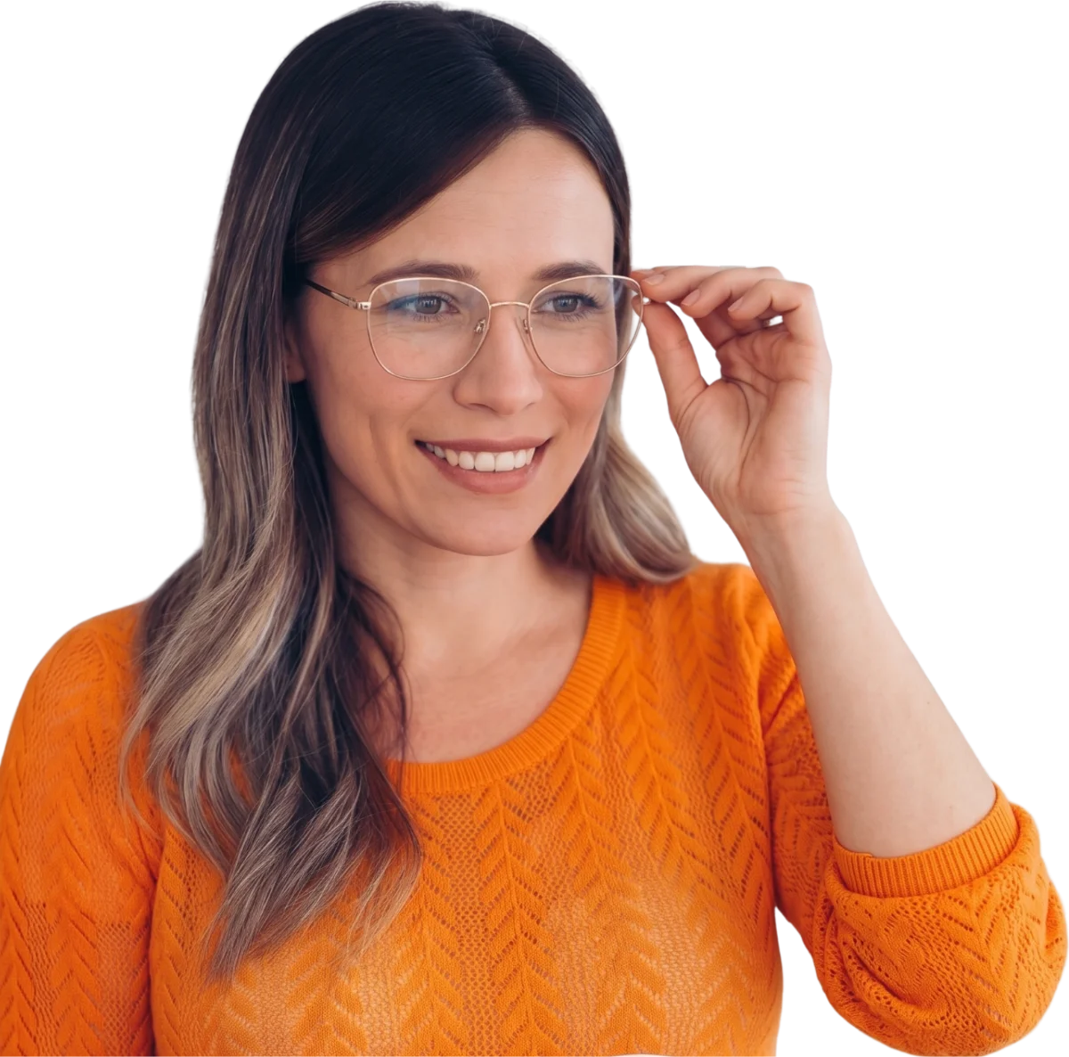 Woman in an orange sweater trying on a new pair of glasses frames